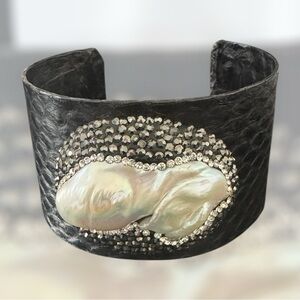Leather cuff with mother of pearl and druzy stones.